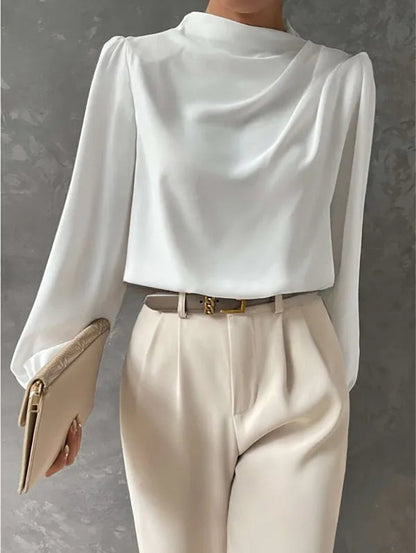 Women's High Neck Long Sleeve Blouse in White, front view with cream trousers – Zélie