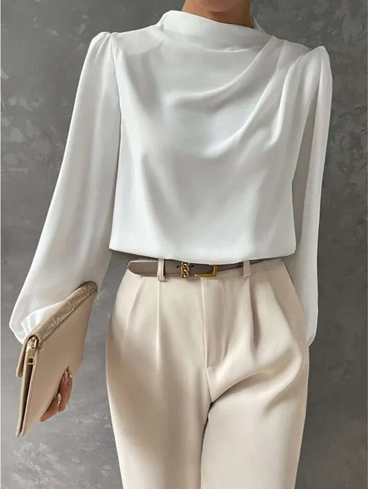 Women's High Neck Long Sleeve Blouse in White, front view with cream trousers – Zélie