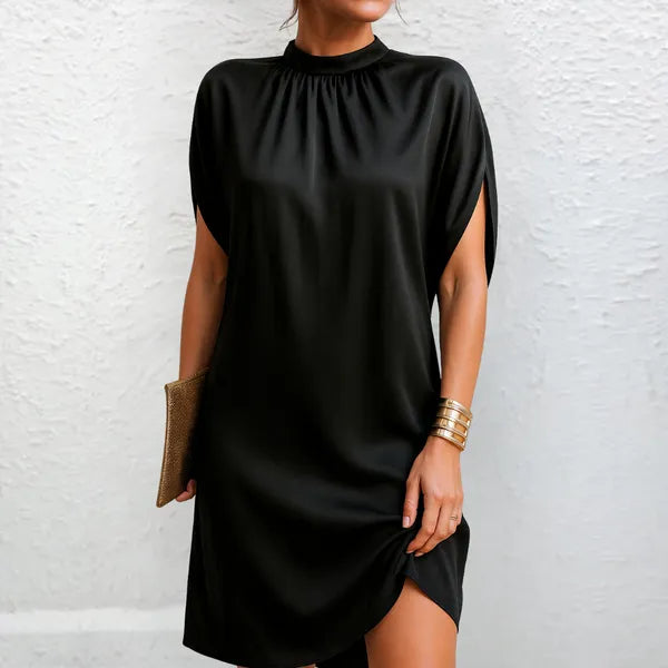 Rose women's high neck mini dress in black, front view on model with clutch