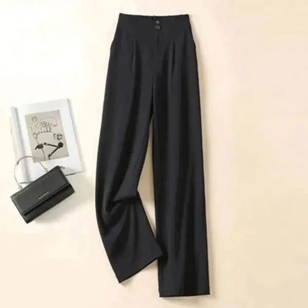 Gabrielle Women's High-Rise Drape Trousers in black, flat lay with handbag