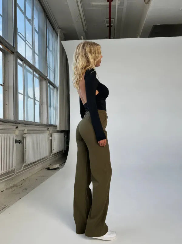 Eloise Women's High-Rise Pintuck Flowy Trousers in army green, side view in studio