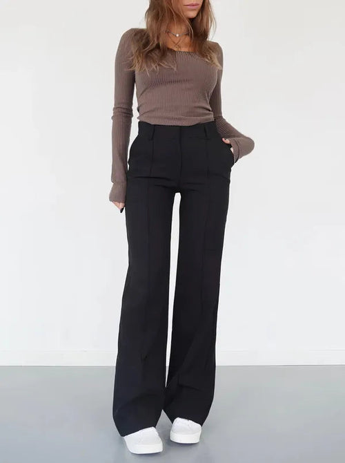 Eloise Women's High-Rise Pintuck Flowy Trousers in black, front view on model