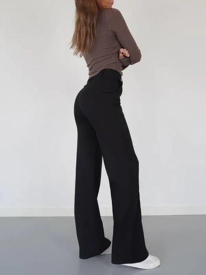 Eloise Women's High-Rise Pintuck Flowy Trousers in black, back view on model