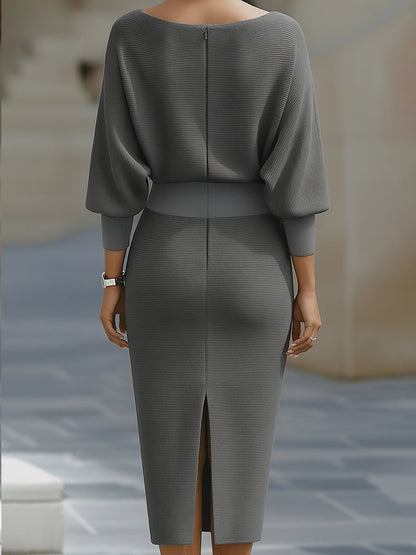 Back of the gray Arabella knit bodycon cocktail midi dress with back slit