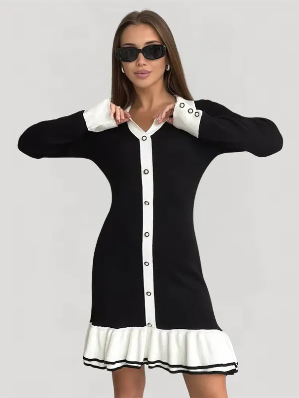 Violet women's knit mini dress in black A with white ruffle hem, front view