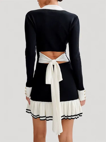 Back view of the black A Violet knit mini dress with open tie back bow