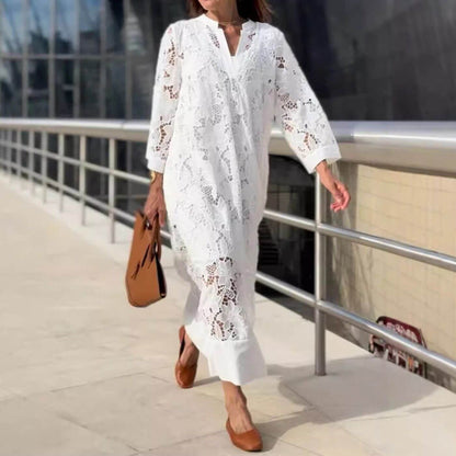 White Janica lace caftan maxi dress, front view on model walking a city terrace