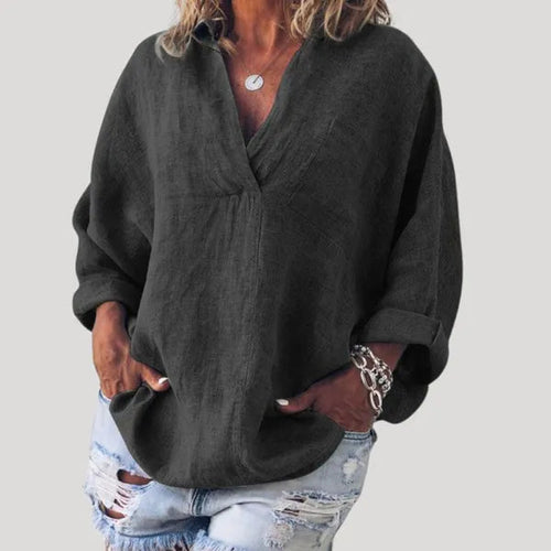 Women's Linen Long Sleeve Blouse in Black, front view with ripped blue jeans – Solène