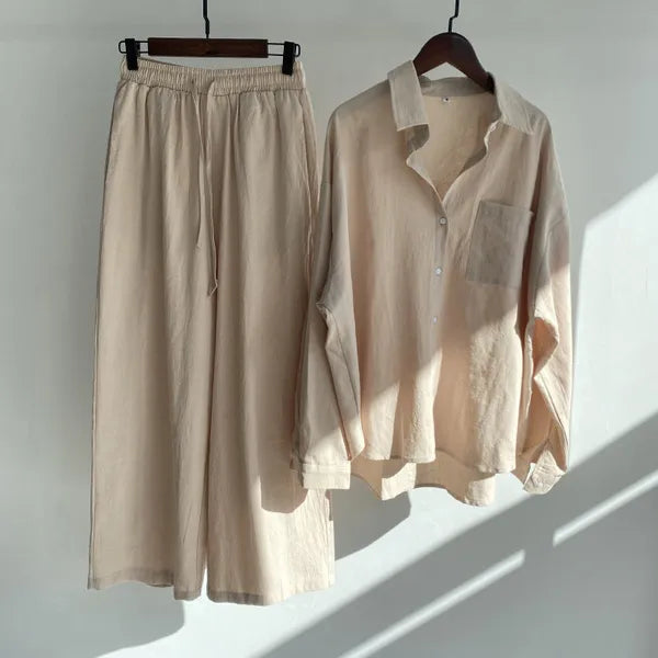 Floriana beige linen shirt and wide leg trousers set displayed on hangers