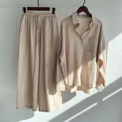 Floriana beige linen shirt and wide leg trousers set displayed on hangers