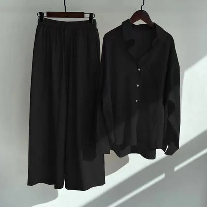 Floriana black linen shirt and wide leg trousers set displayed on hangers