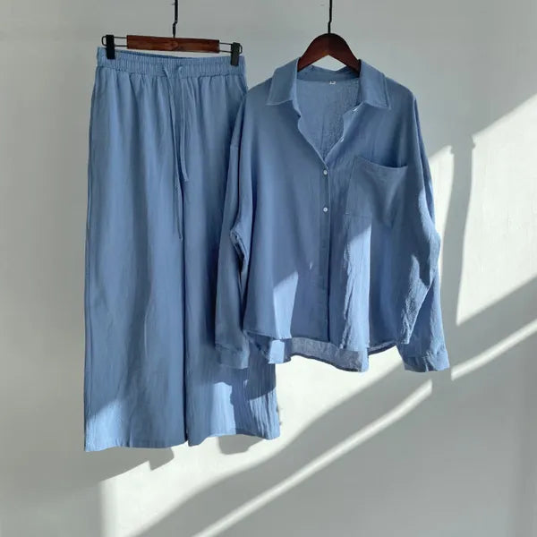 Floriana blue linen shirt and wide leg trousers set displayed on hangers