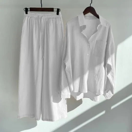 Floriana white linen shirt and wide leg trousers set displayed on hangers
