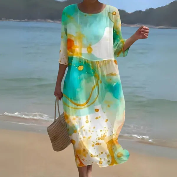 Green Kallie long sleeve caftan maxi dress in watercolour print, front view seaside