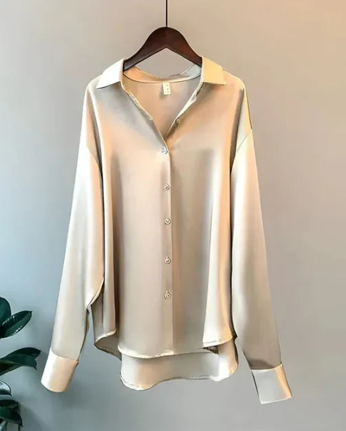 Women's Long Sleeve Collared Blouse in Beige satin, shown on a wooden hanger – Nives