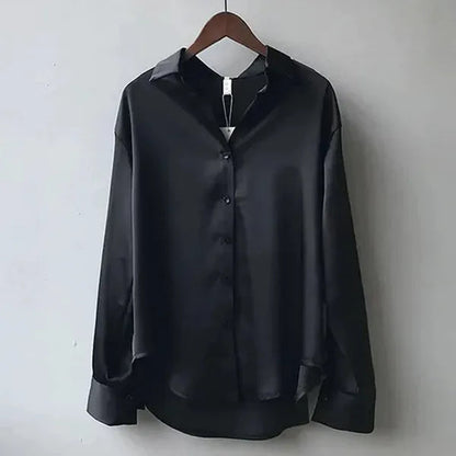 Women's Long Sleeve Collared Blouse in Black satin, hanger view of the front – Nives