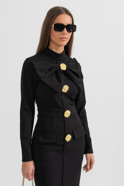 Black Mireille midi dress with bow collar and gold buttons, cropped front