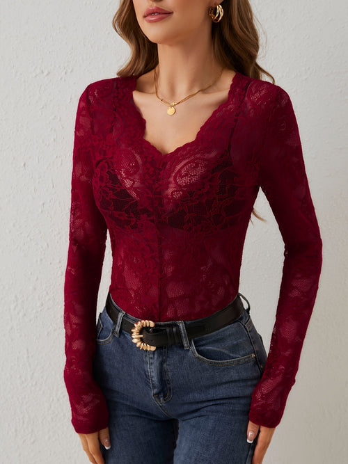Maialen Women's Long Sleeve Lace V Neck Top in dark red, front view with jeans