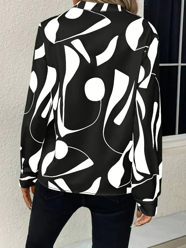 Women's Long Sleeve Print Blouse in Black, back view on model with dark jeans – Linnea