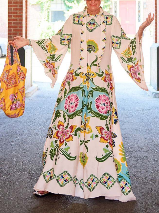 Cream Fern long sleeve printed maxi dress, front view on a city street with a tote
