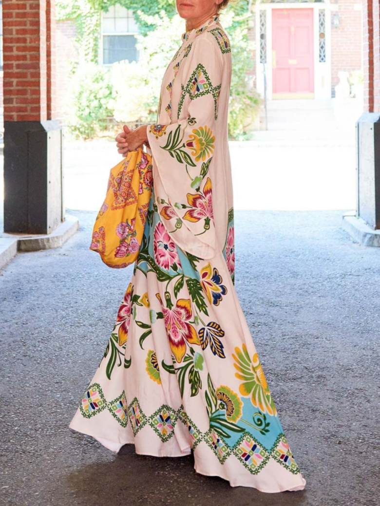 Fern cream printed maxi dress, side view showing the sweep of the floral skirt