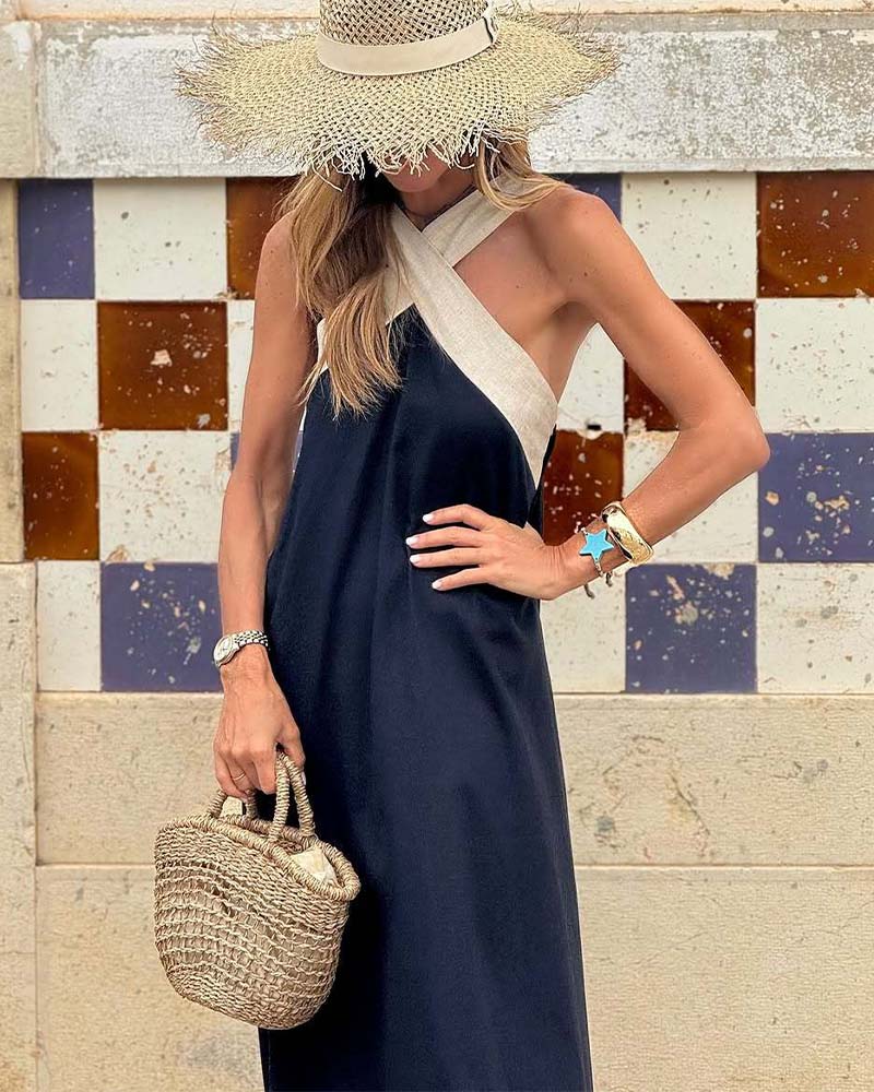 Hadrienne loose halter maxi dress in navy with ivory straps, cropped front view