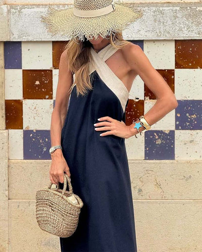 Hadrienne loose halter maxi dress in navy with ivory straps, cropped front view