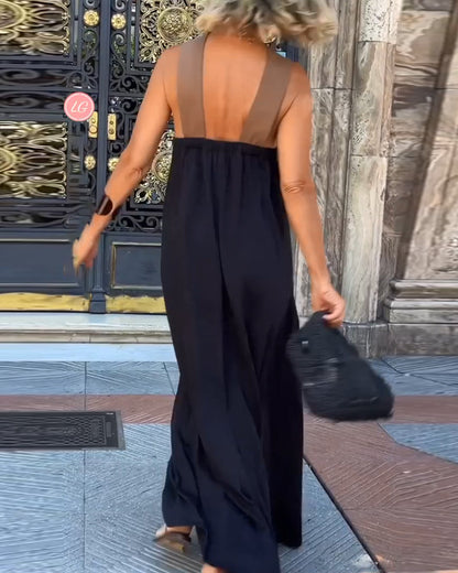 Black Hadrienne loose halter maxi dress from behind, wide crossover back straps