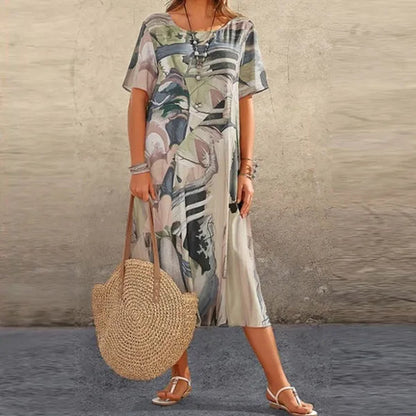 Gray Women's Mid-Calf Short Sleeve Midi Dress - Emmanuelle, abstract print worn with straw bag