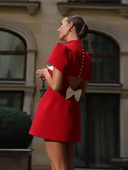 Red Mock Neck Cocktail Mini Dress rear angle view highlighting open back bow detail