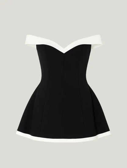 Black Off-Shoulder Contrast Mini Dress flatlay showing ivory trimmed hem and neckline