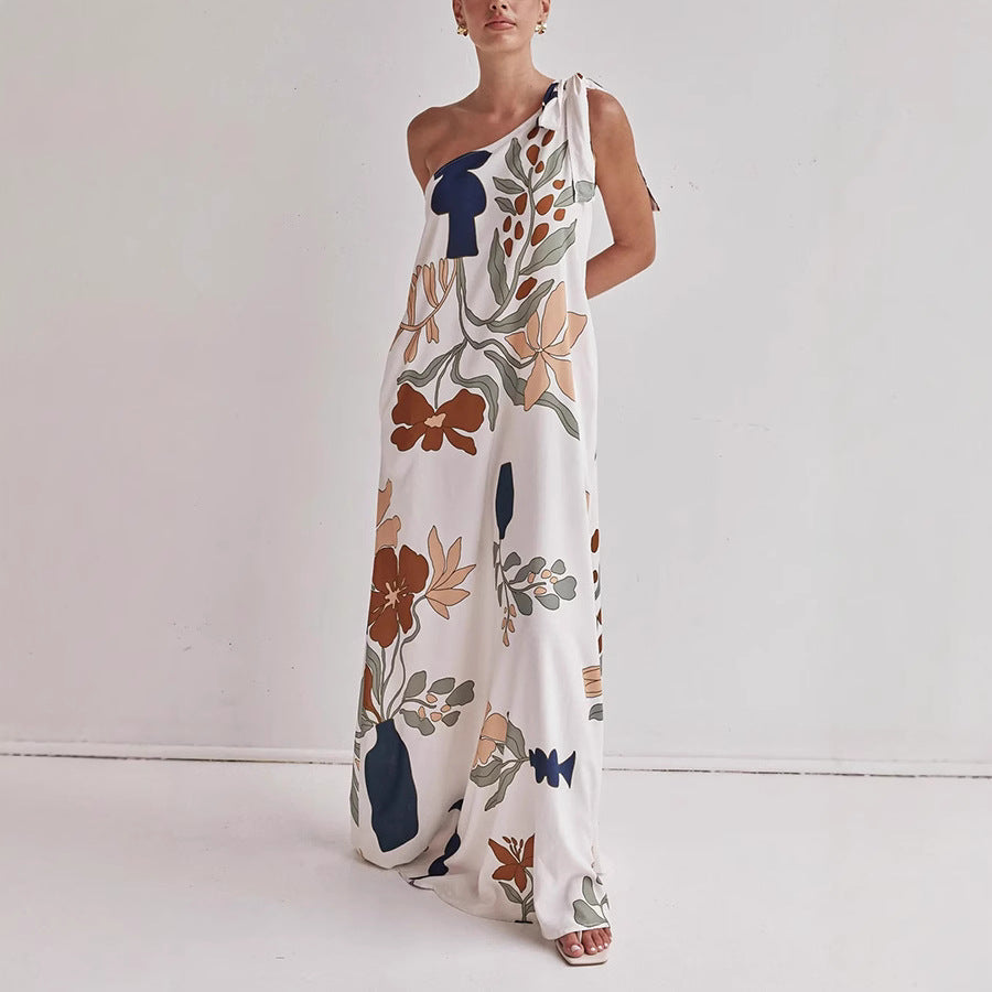 Kora apricot floral one shoulder maxi dress shown front-on with knotted shoulder tie