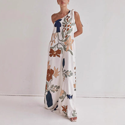 Kora apricot floral one shoulder maxi dress shown front-on with knotted shoulder tie