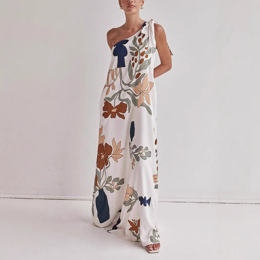 Kora apricot floral one shoulder maxi dress shown front-on with knotted shoulder tie