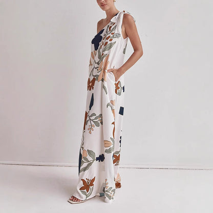 Side view of the Kora women's one shoulder floral maxi dress in apricot print