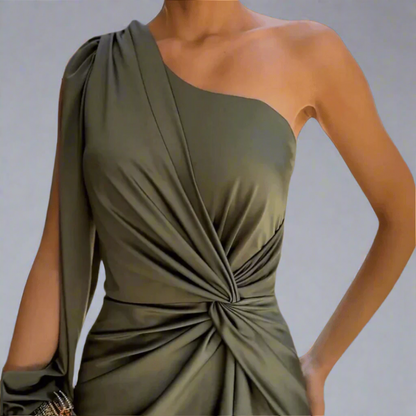Close-up of the twisted waist detail on the green Leonora maxi dress