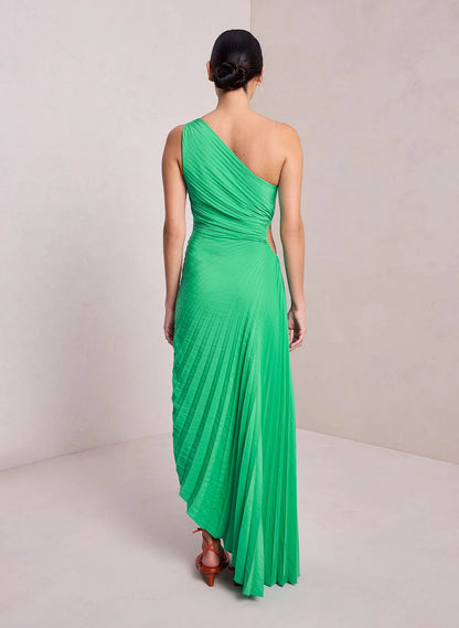 Back view of the green Inka one-shoulder pleated maxi dress on the model