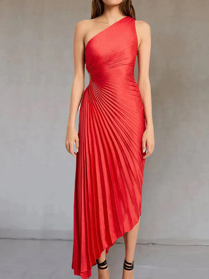 Red Inka pleated maxi dress with sunburst pleating, front-facing studio shot