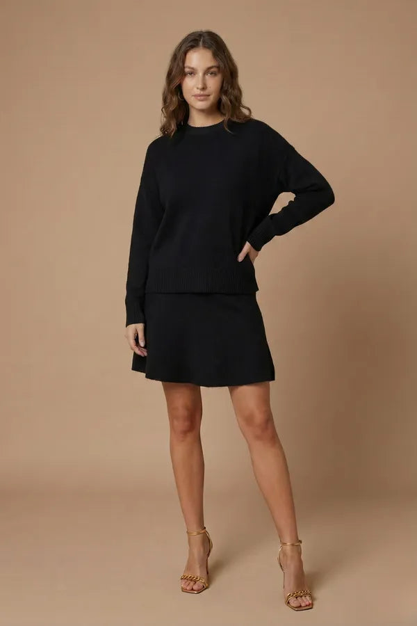 Carmina women's two-piece knit sweater and mini skirt set in black, front view