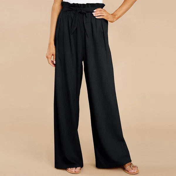 Fleur Women's Paperbag Waist Palazzo Pants in black, front view on model