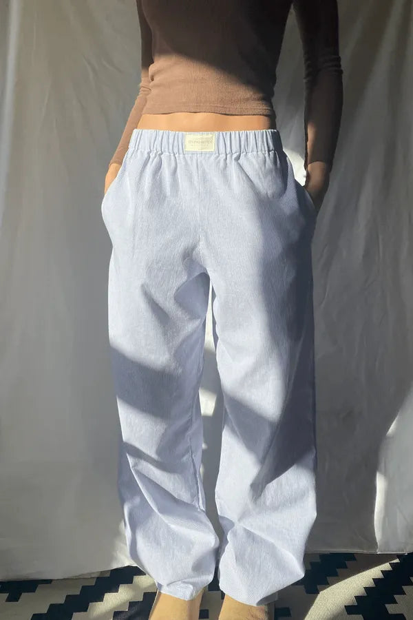Belle Women's Pinstripe Pajama-Style Trousers in blue stripe, front view on model