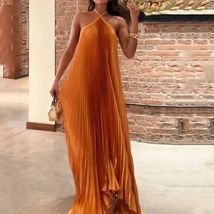 Orange Hope pleated halter maxi dress with flowing skirt, front pose
