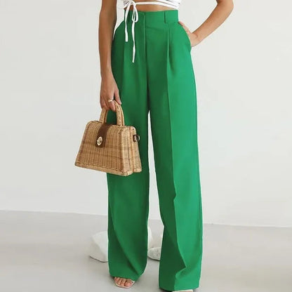 Valerial Women's Pleated Palazzo Pants in green, front view with straw bag
