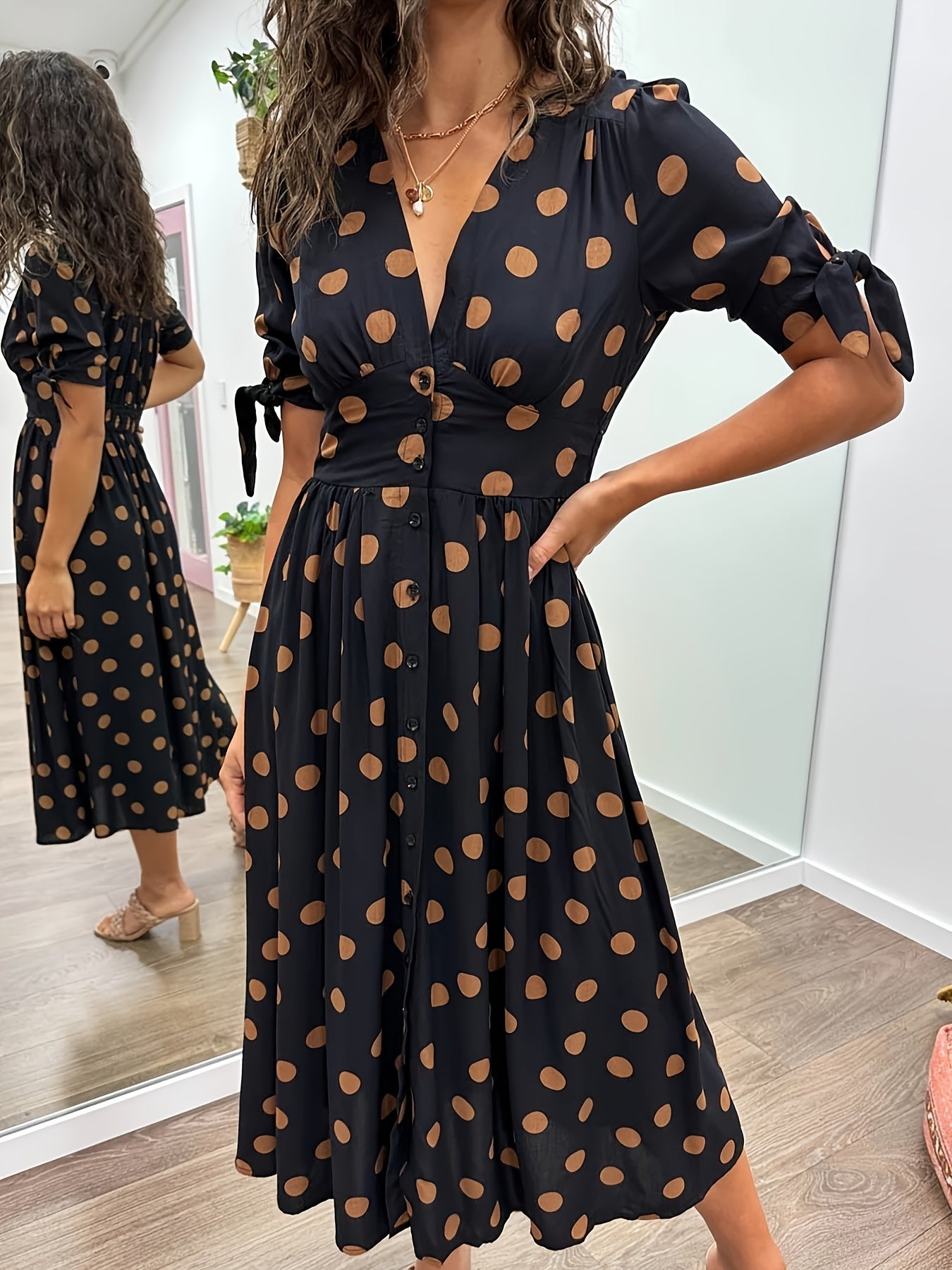 Black Women's Polka Dot V Neck Midi Dress - Amaris with tan dots, front view on model