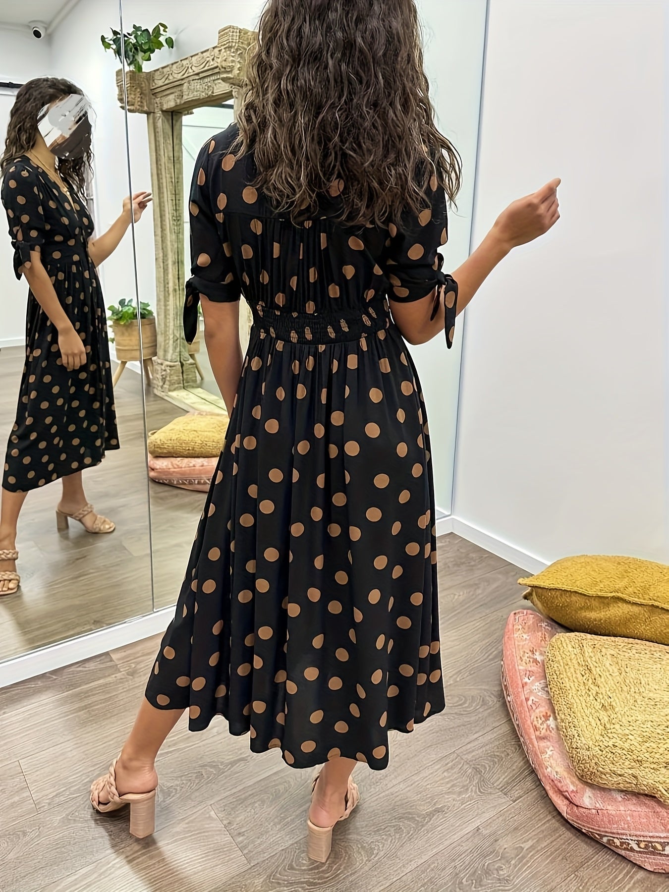 Black Women's Polka Dot V Neck Midi Dress - Amaris, back view showing the shirred waist