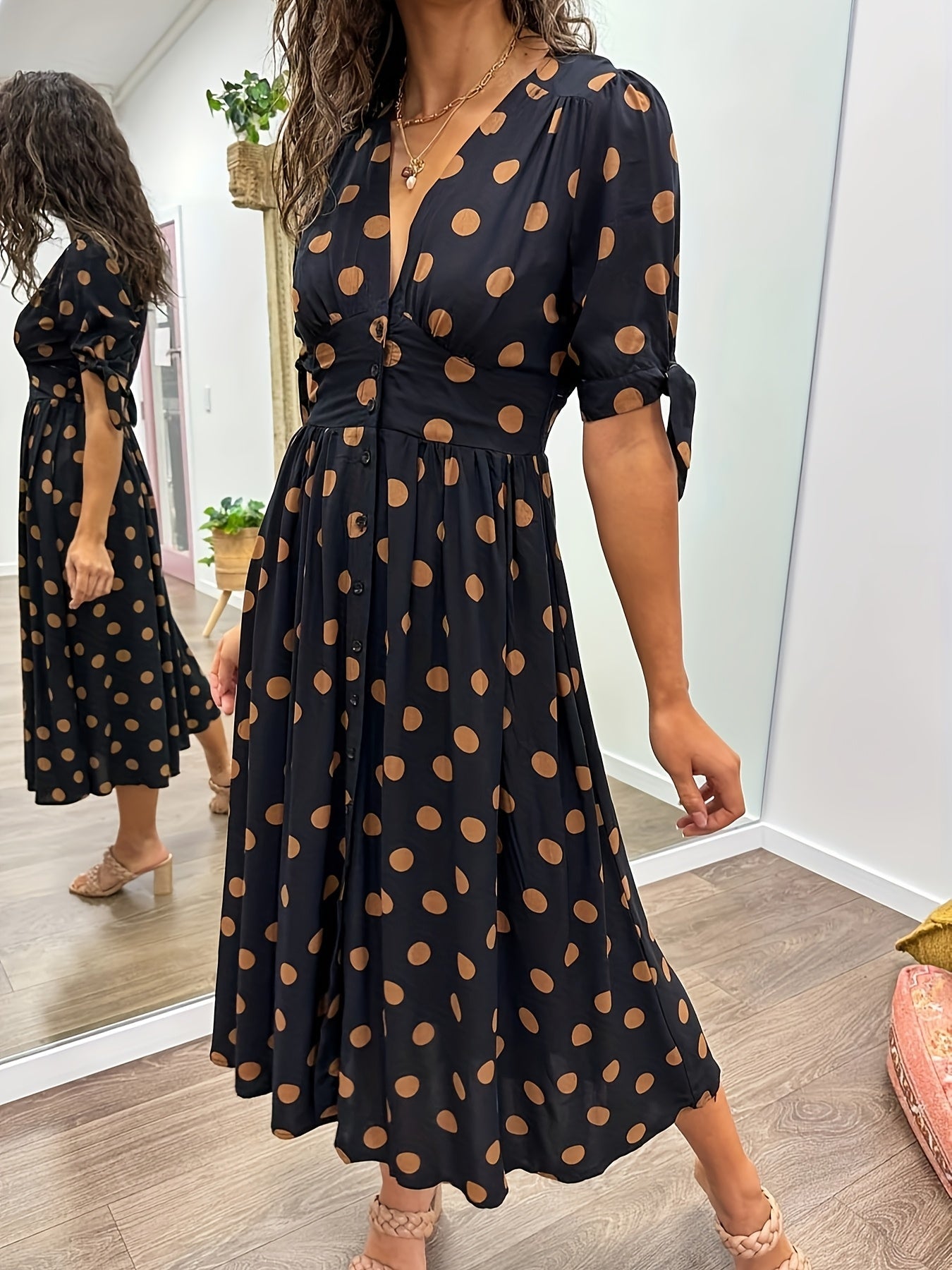 Black Women's Polka Dot V Neck Midi Dress - Amaris, front view of the buttoned V neckline