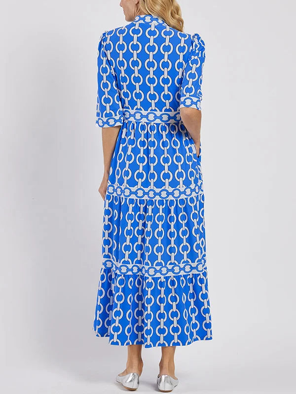 Back view of the Ninon blue print blouson tiered maxi dress on model
