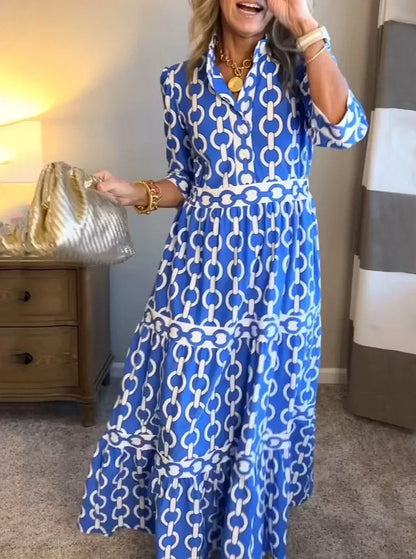 Ninon blue chain print tiered maxi dress worn at home, front view