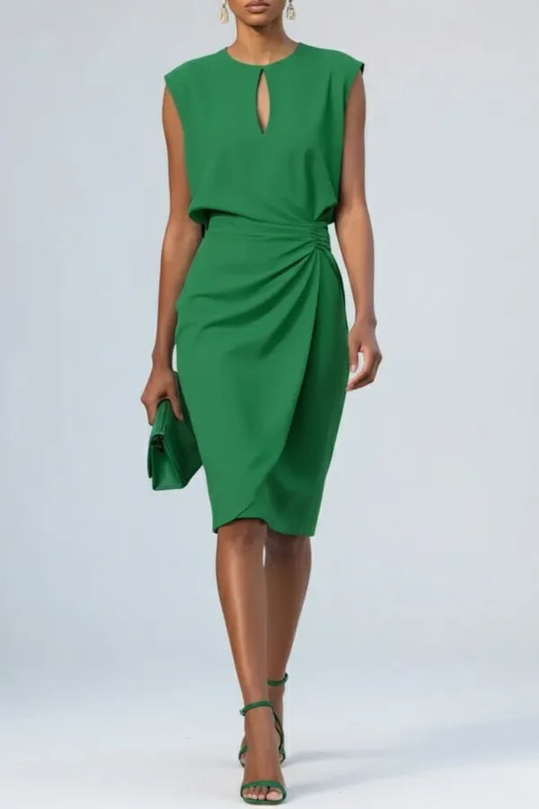 Sandy women's ruched midi dress in green, front view on model with clutch