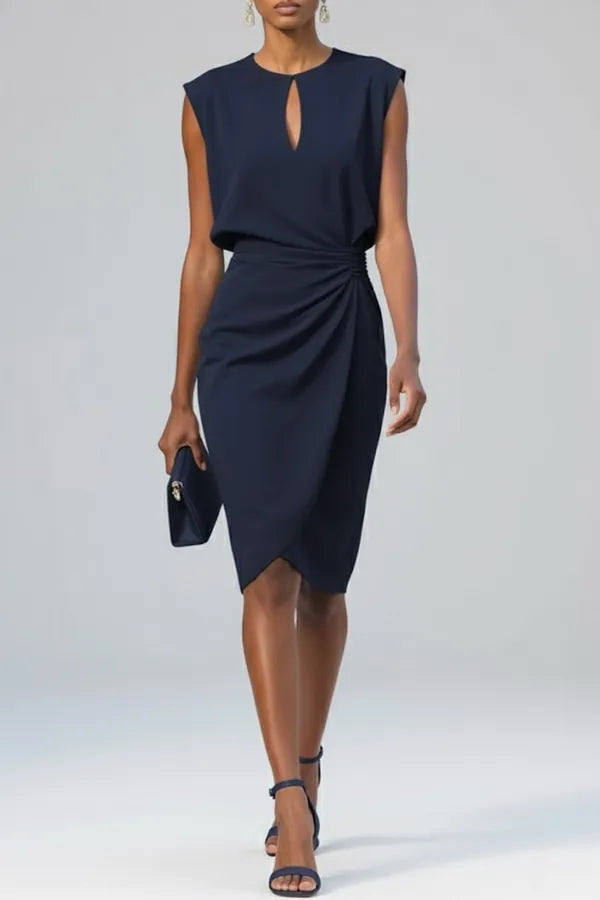 Sandy women's ruched midi dress in navy blue, front view on model with clutch